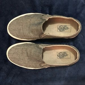 Gray Slip-on Vans.